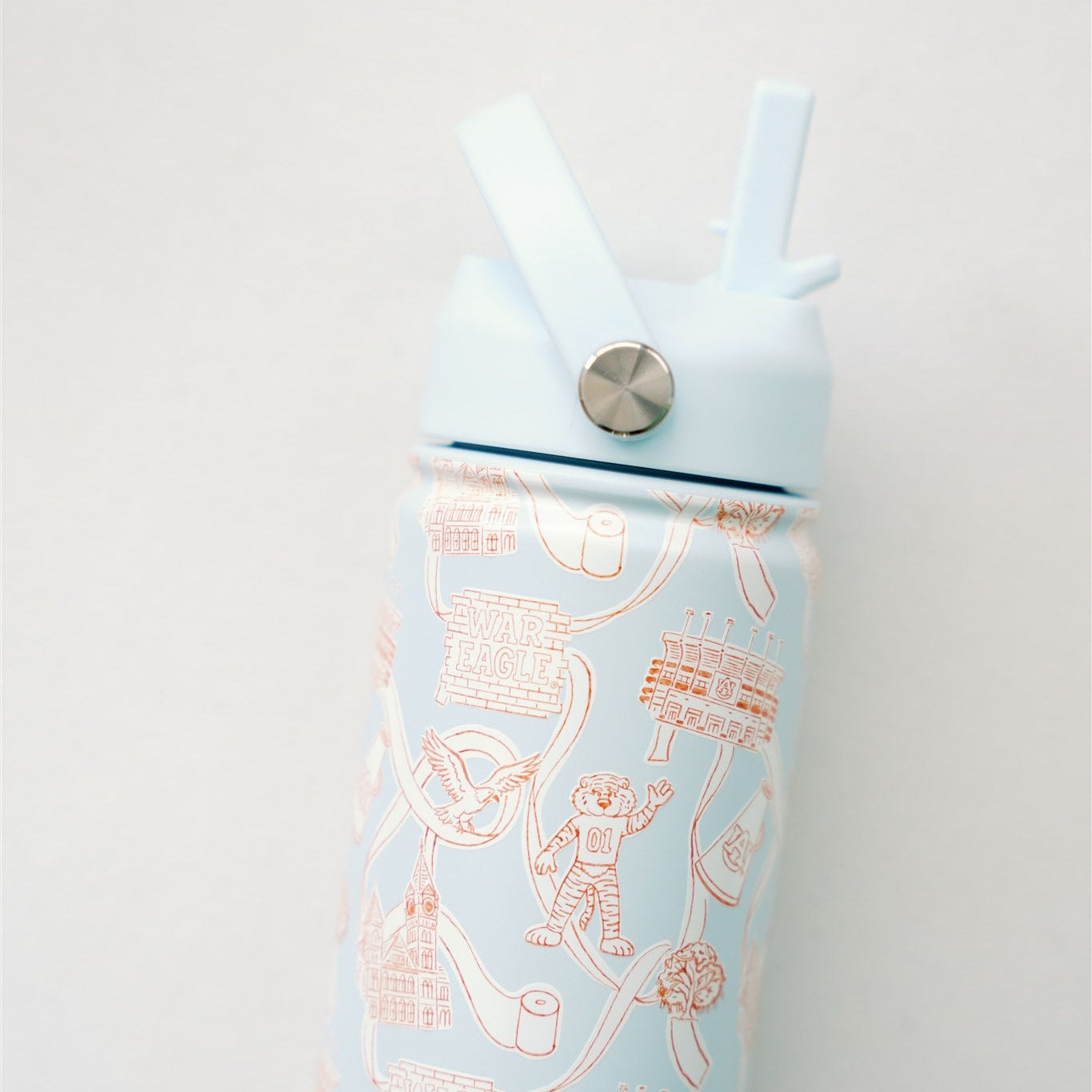 Light blue water bottle with orange and white Auburn University design on a white background