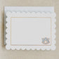 Stationery with scalloped edges, a gold rim, and a watercolor Auburn logo.