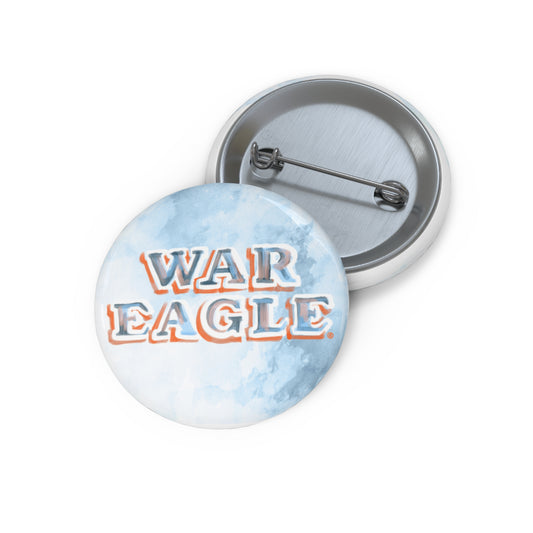 Blue button with watercolor "War Eagle" on it.