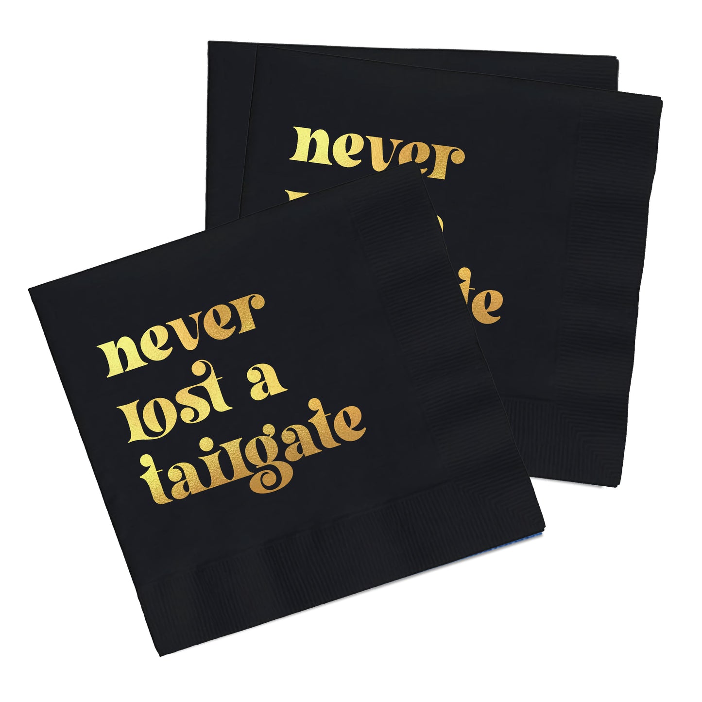 Black napkin with "never lost a tailgate" written on it in gold.