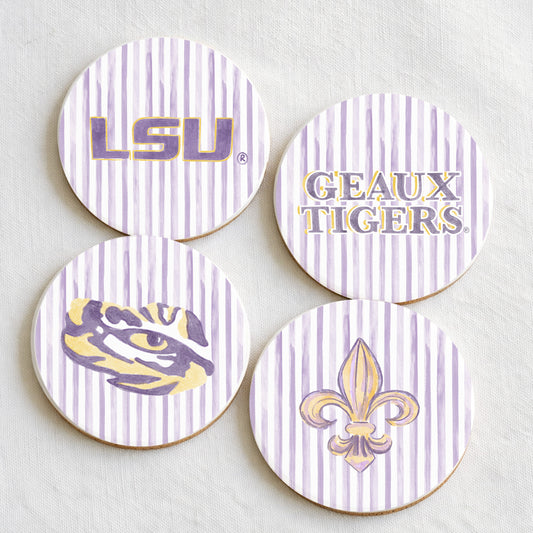 Four LSU-themed coasters with logos and text on a light background