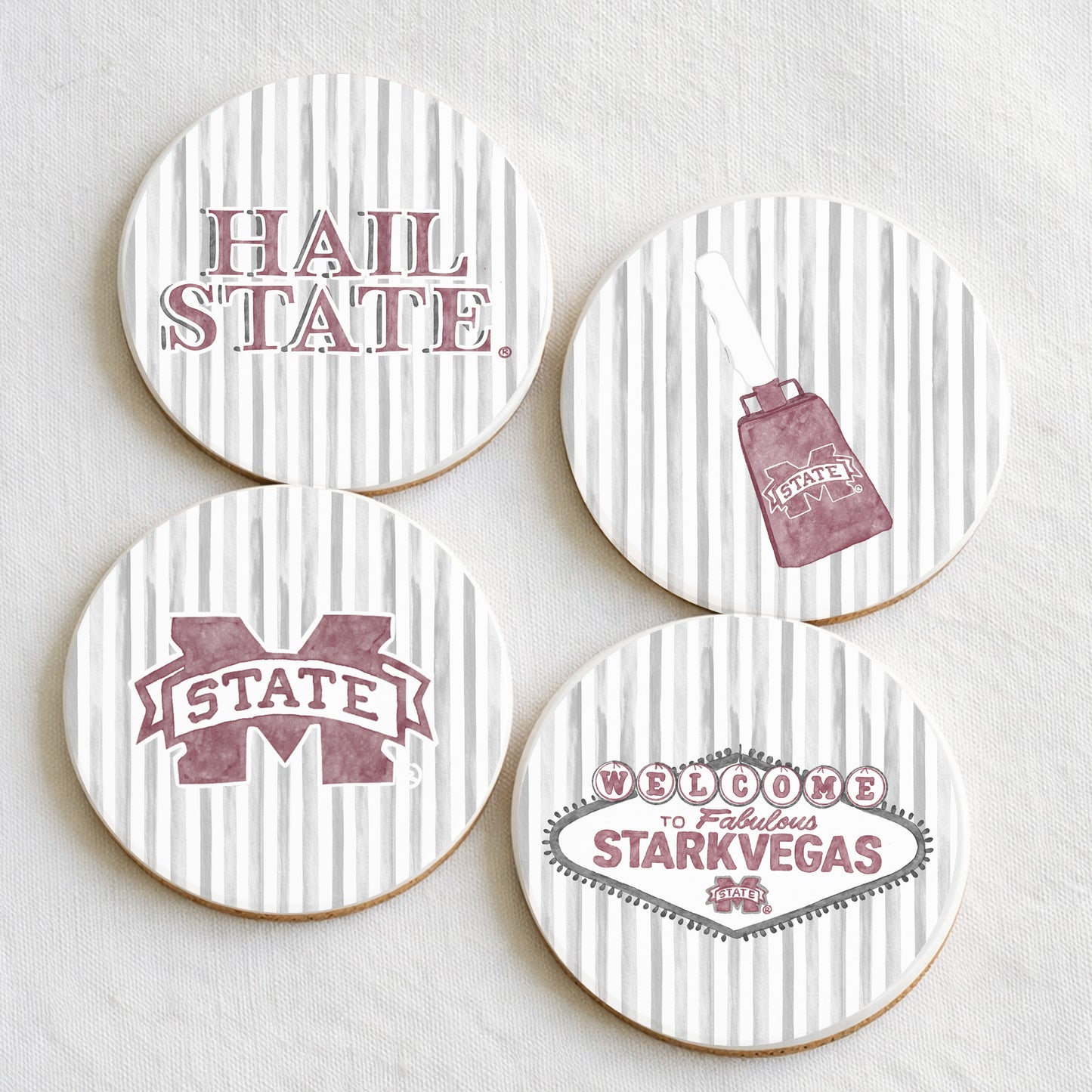 Four coasters with Mississippi State illustrations on a white background