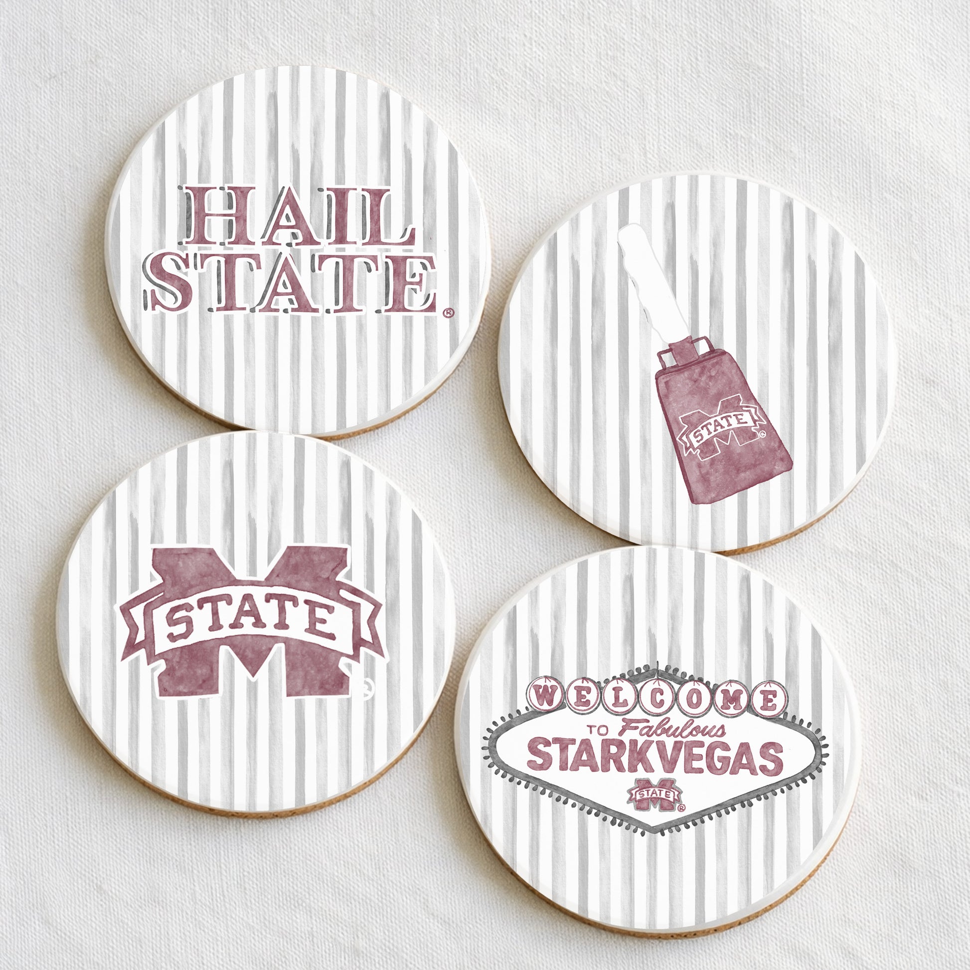 Four coasters with Mississippi State illustrations on a white background