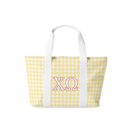 Yellow gingham tote bag with red Chi Omega Greek letters on a white background