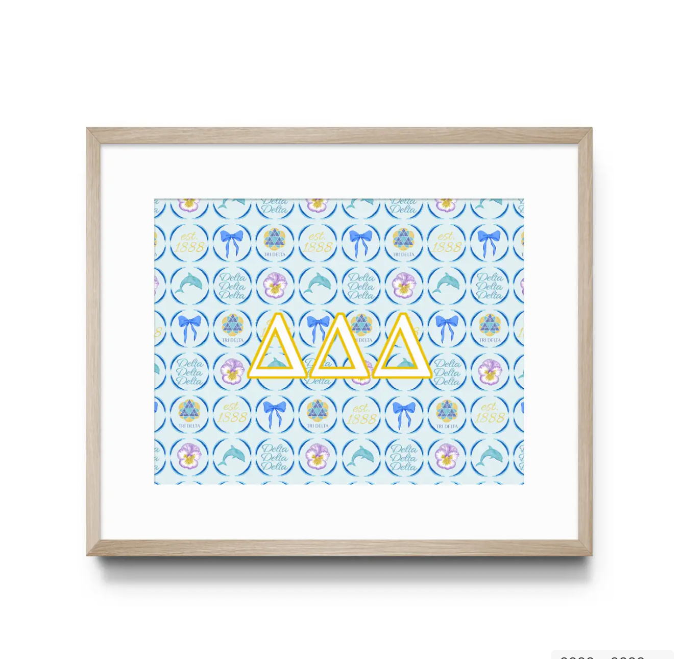 Framed artwork with Tri Delta Greek letters and decorative pattern on a white background