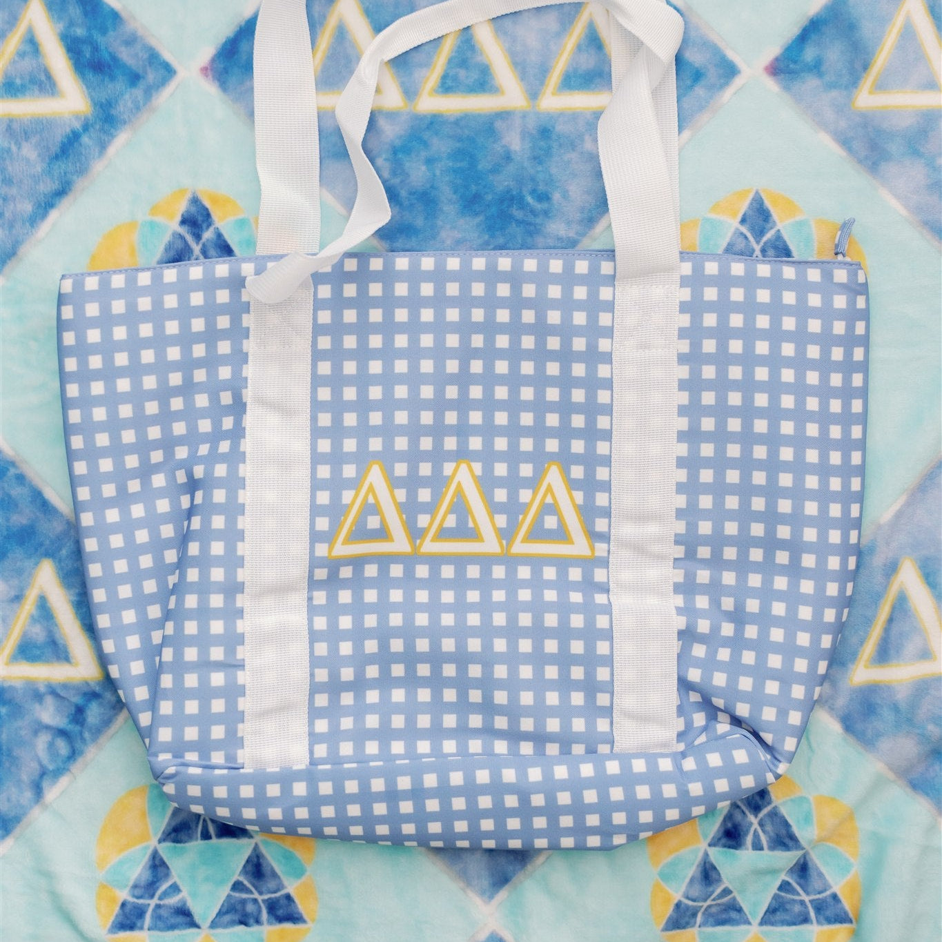 Blue checkered tote bag with Tri Delta Greek letters on the flannel fleece blanket for Tri Delta