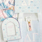 Collection of Delta Gamma themed products including a photo frame, keychain, and blanket on a white background.