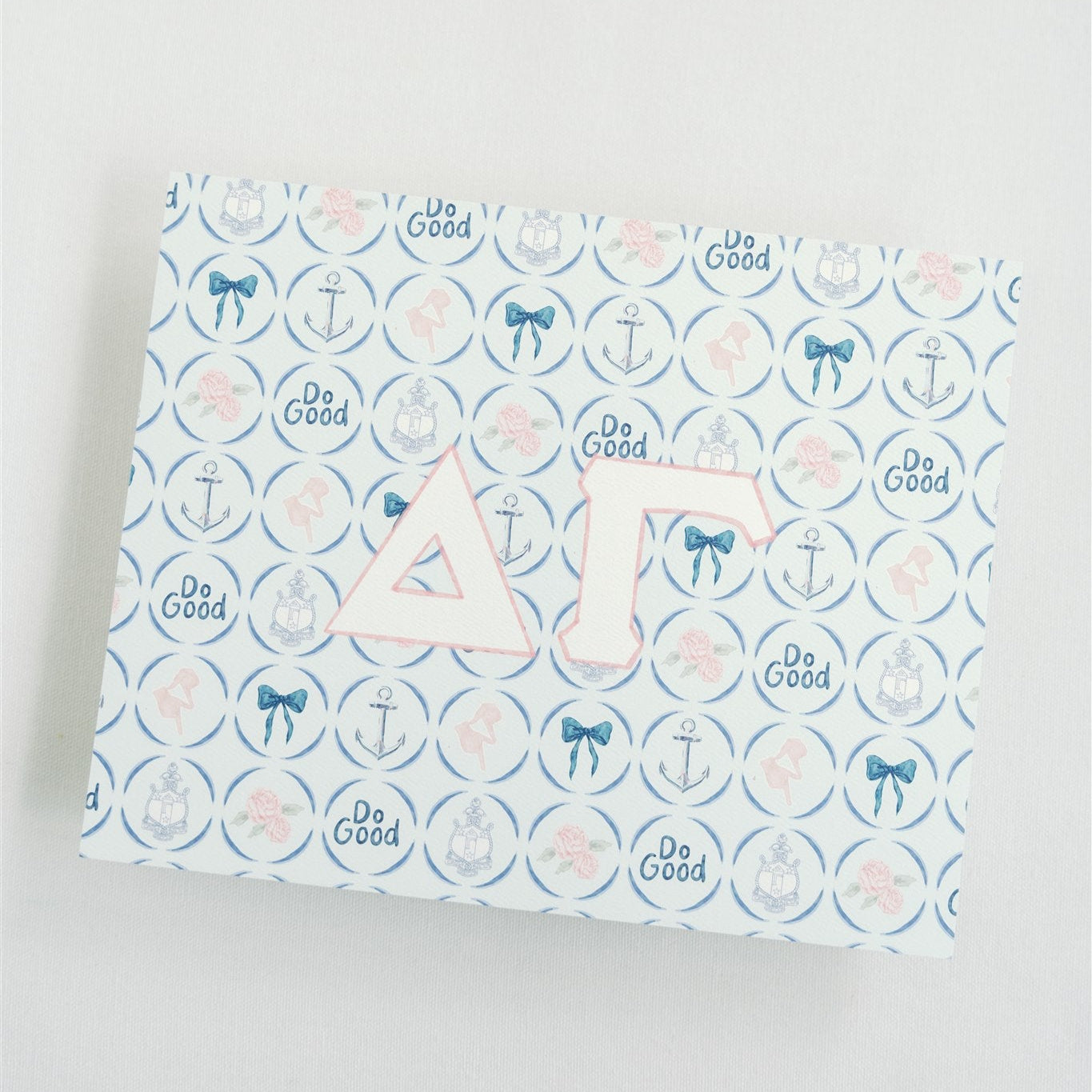 Art print with 'Do Good' and Delta Gamma Greek letters on a light blue background