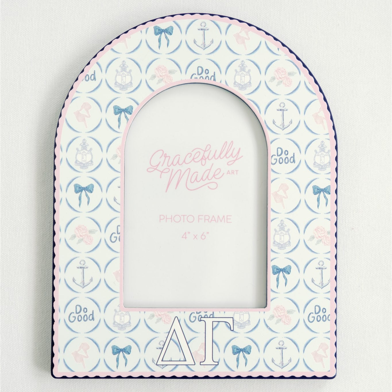Decorative photo frame with patterns and Delta Gamma Greek letters on a white background