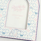 Close up of photo frame with Delta Gamma pattern and Greek letters