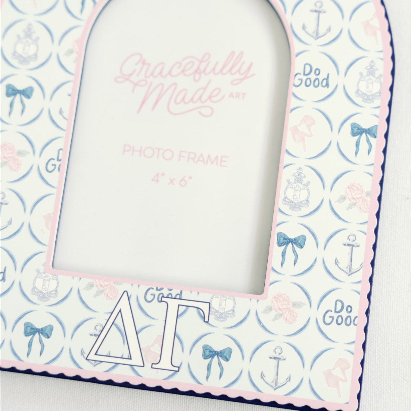 Close up of photo frame with Delta Gamma pattern and Greek letters