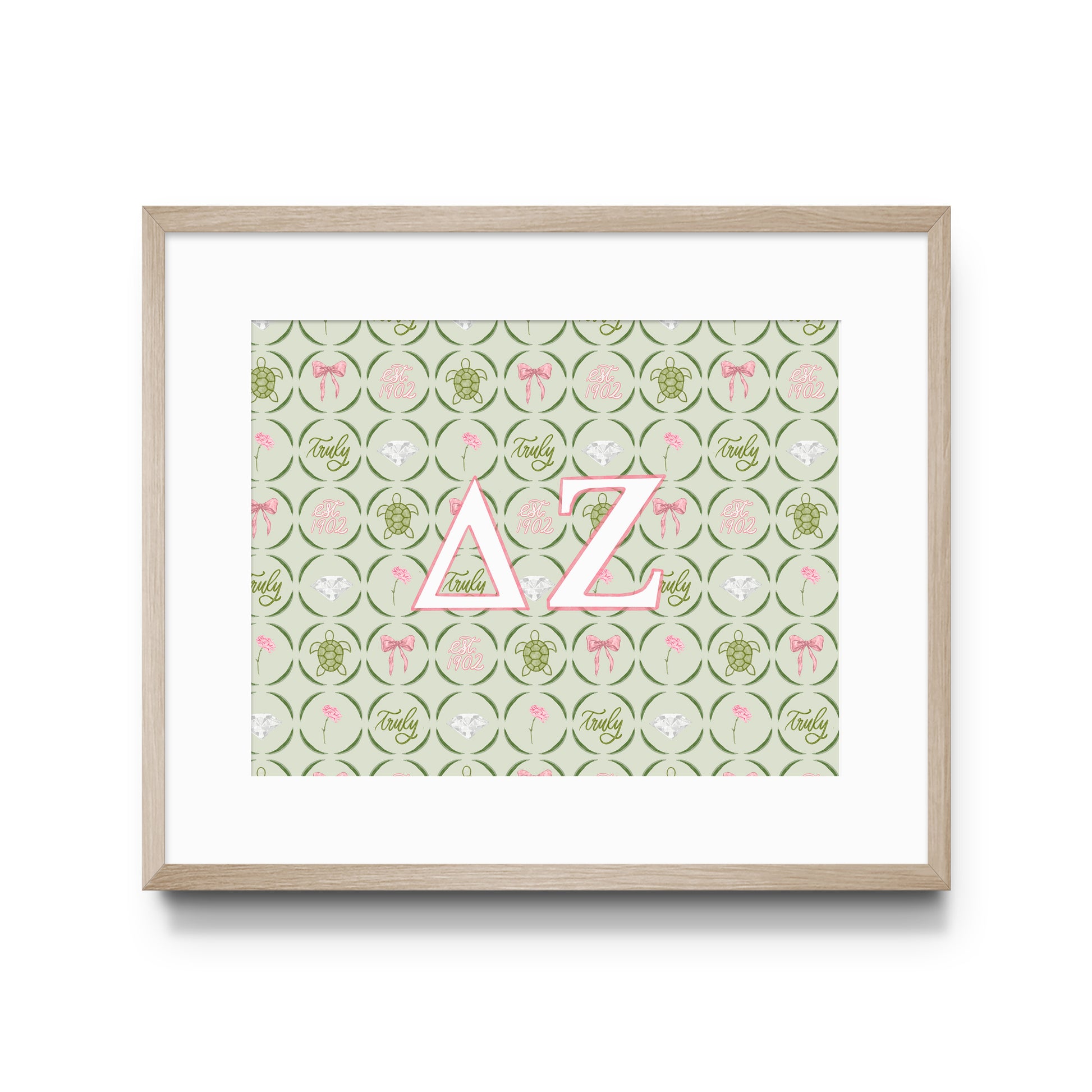 Framed artwork with pink Delta Zeta Greek letters on a patterned background