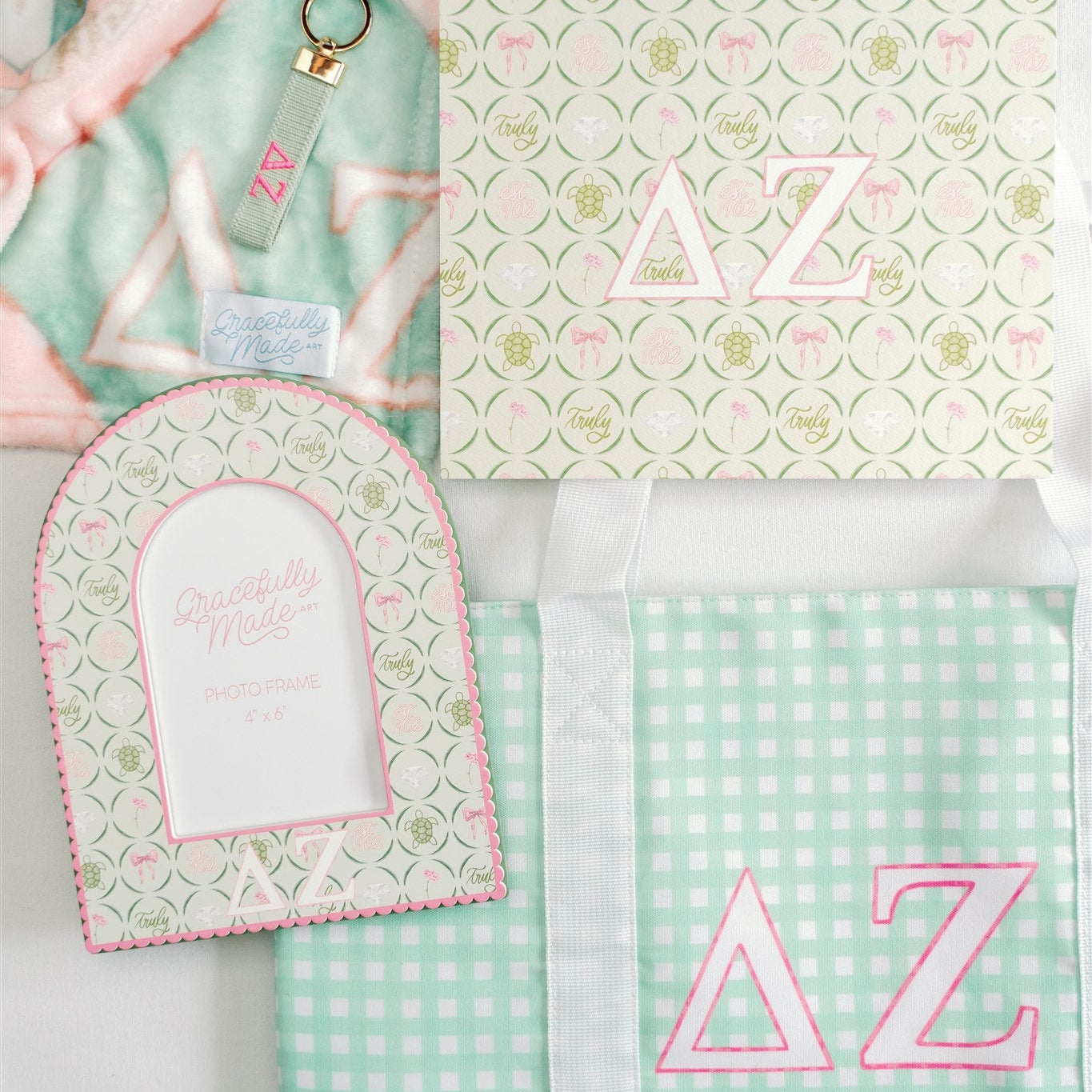 Collection of Delta Zeta items with lettering and patterns on a light green background.