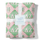 Flannel fleece blanket with pink and green pattern and Delta Zeta Greek letters