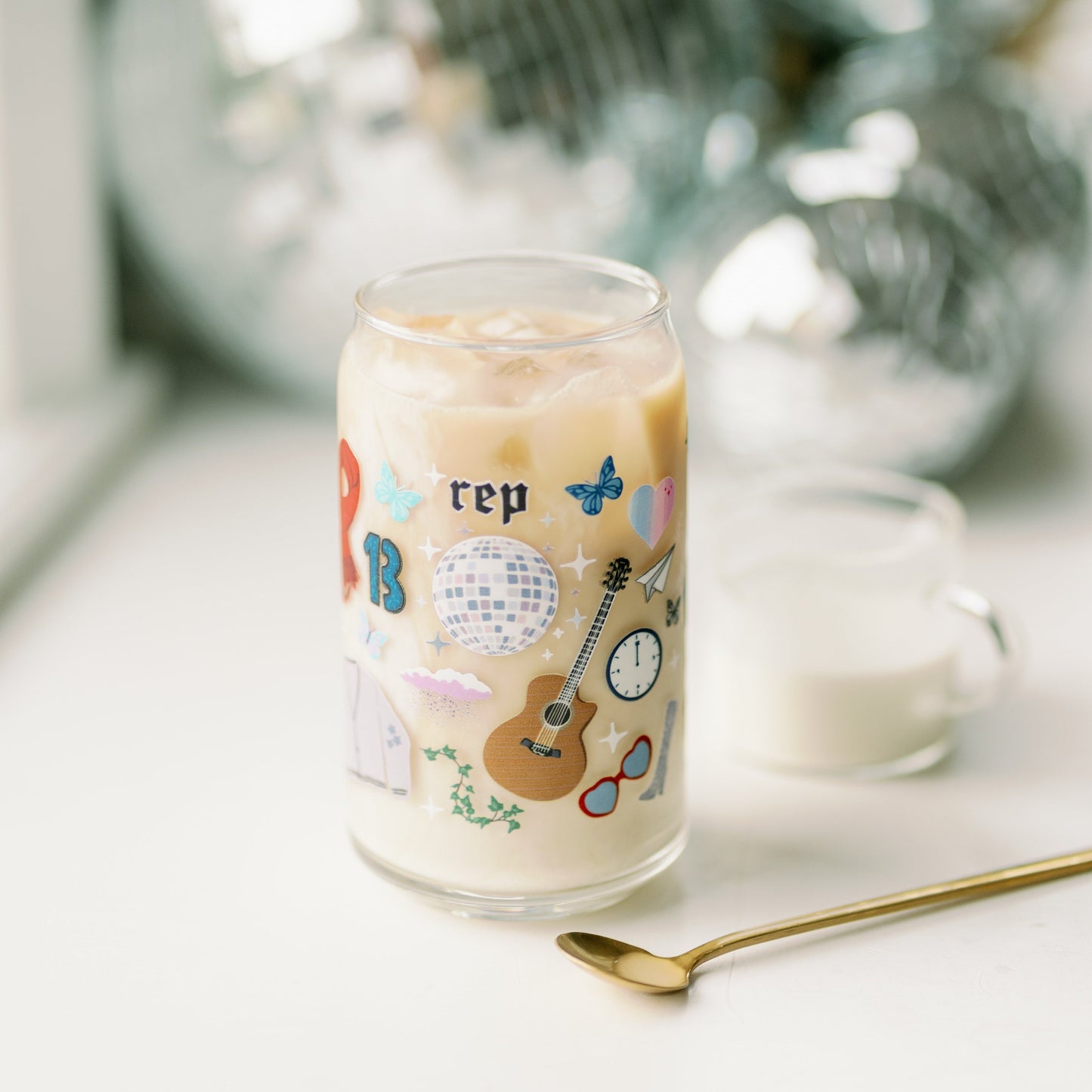 Clear glass with Taylor Swift symbols on it.