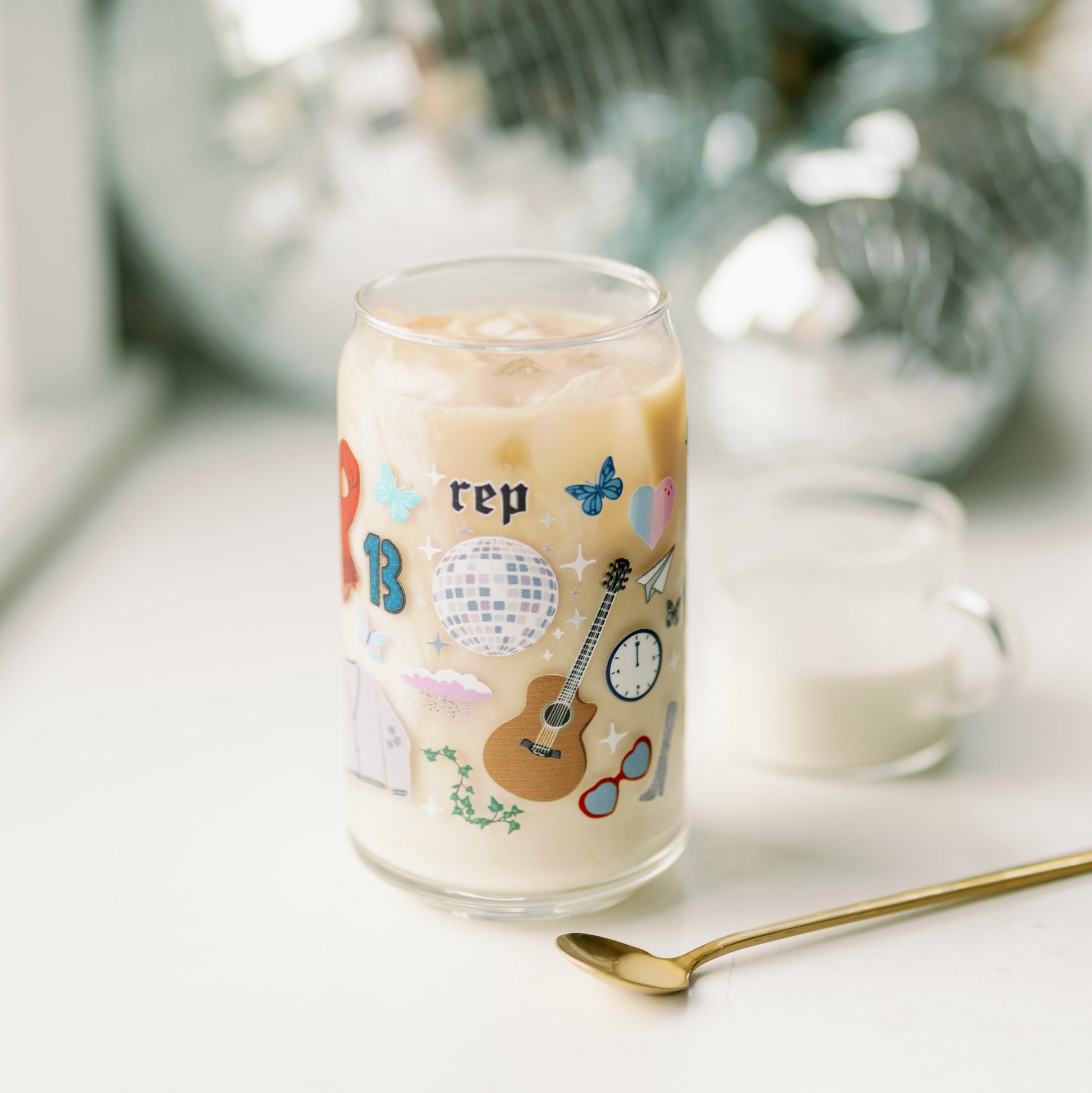 Clear glass with Taylor Swift symbols on it.