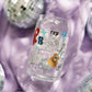Clear glass with Taylor Swift symbols on it.