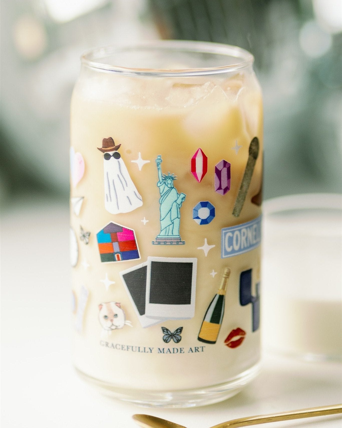 Clear glass with Taylor Swift symbols on it.