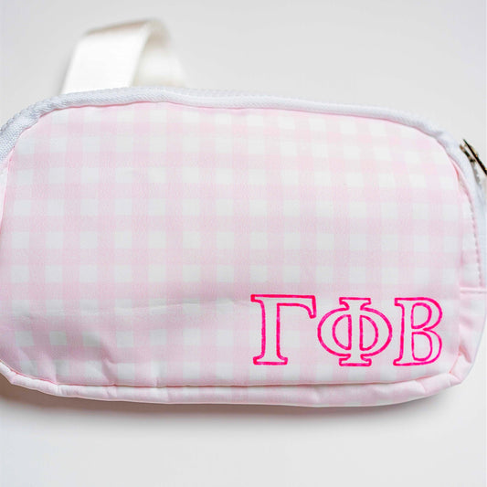 Pink and white checkered pouch with 'Gamma Phi Beta' letters on a white background
