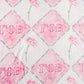 Blanket with pink and white diamond pattern and 'Gamma Phi Beta' letters.