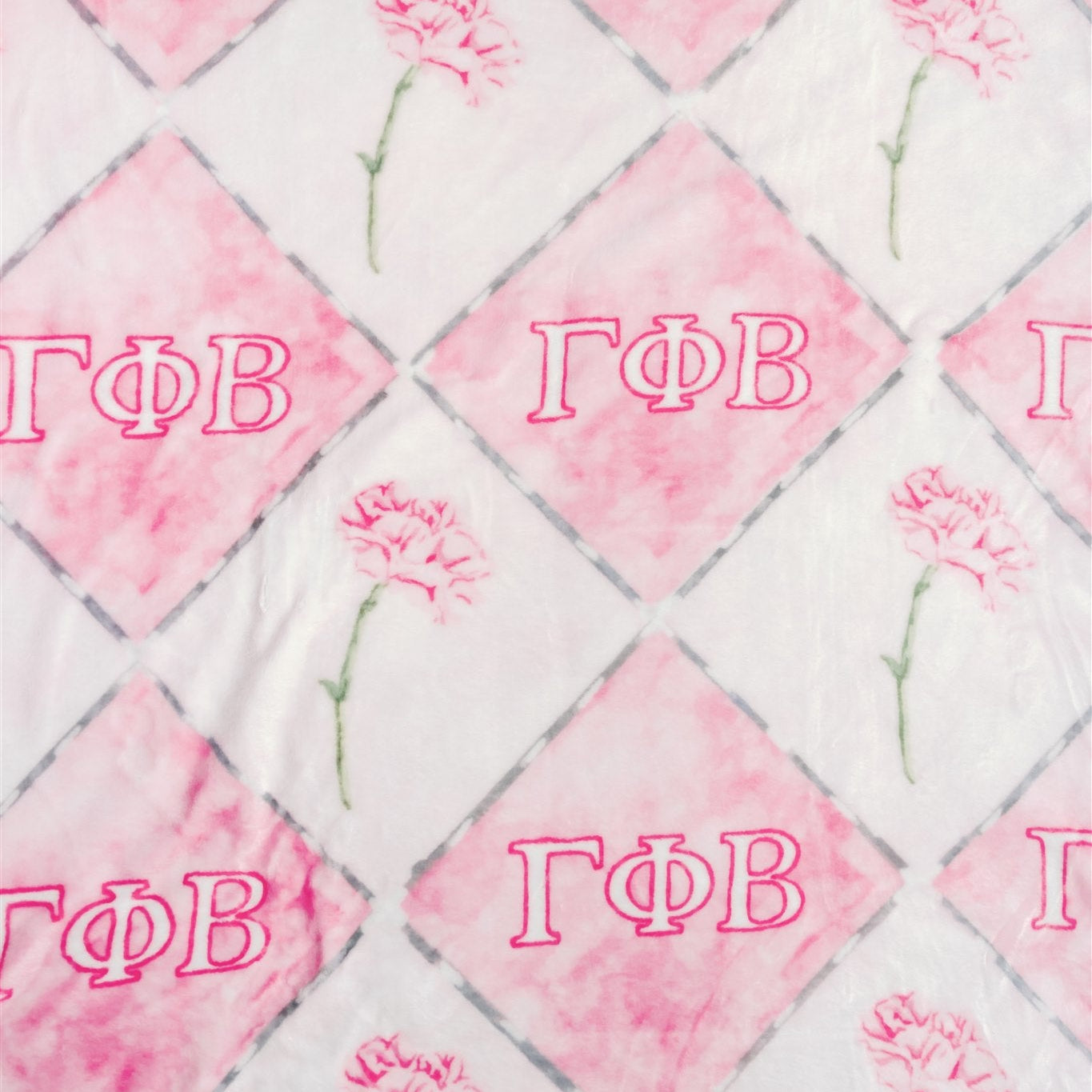 Blanket with pink and white diamond pattern and 'Gamma Phi Beta' letters.
