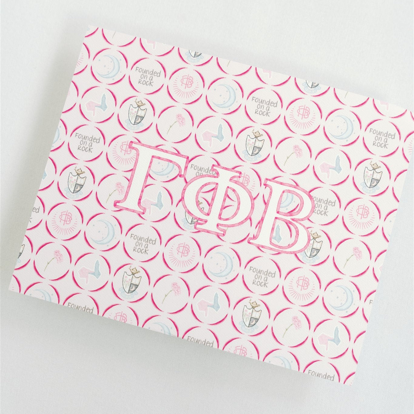 Pink and white patterned art print with Gamma Phi Beta Greek letters on a light gray background