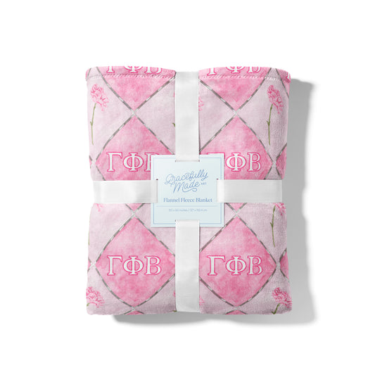Light pink and dark pink checkered blanket with Gamma Phi Beta Greek letters 
