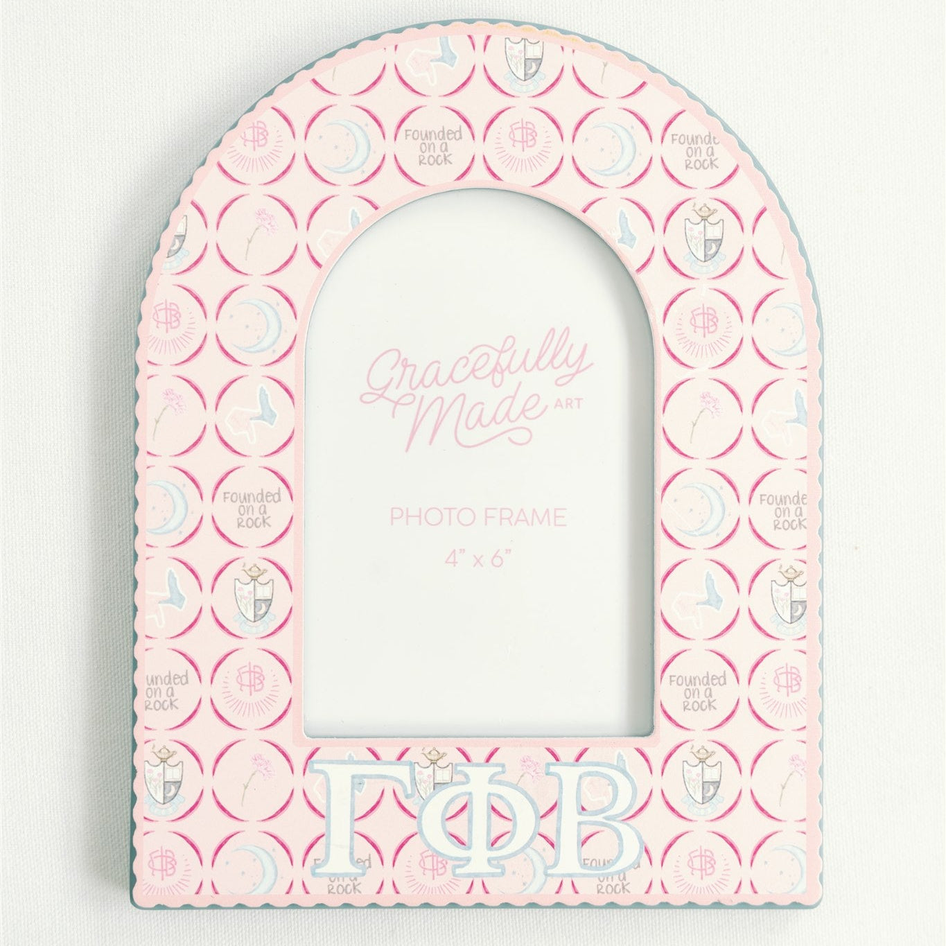 Pink arch-shaped photo frame with 'Gamma Phi Beta' Greek letters and decorative patterns on a white background.