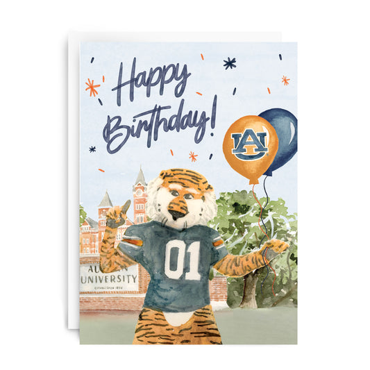 Card with the Auburn University tiger mascot holding balloons and text saying 'Happy Birthday.'