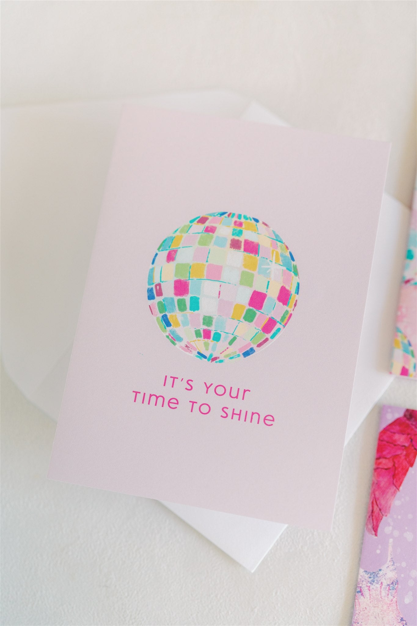 Light pink card with a colorful disco ball and "it's your time to shine" on the front.