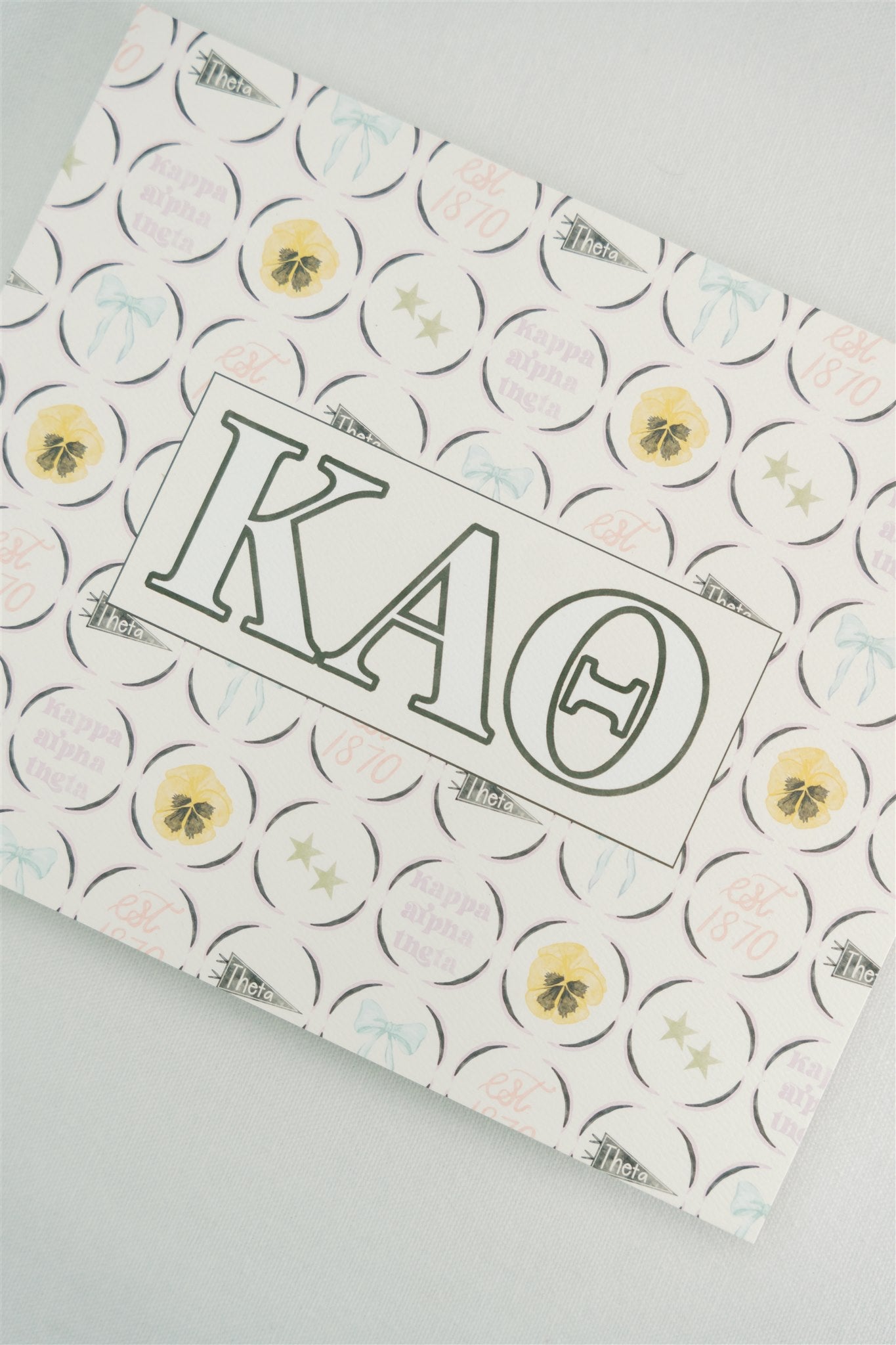 Art print with Kappa Alpha Theta Greek letters and a yellow and black pattern on a white background.