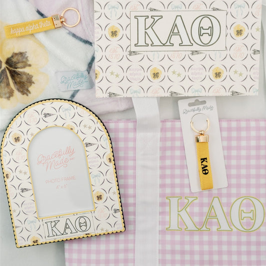 Decorative items with Kappa Alpha Theta Greek letters and colors including a photo frame and art print.