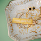 Decorative jewelry dish with a gold keychain with Kappa Alpha Theta embroidered on it