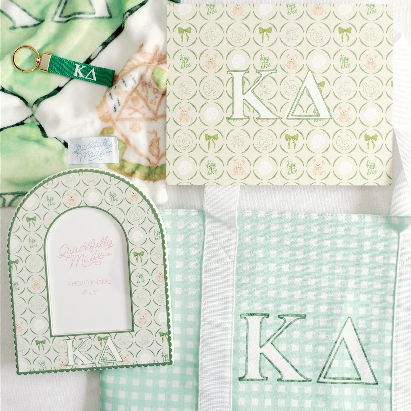 Collection of green and white patterned products with 'Kappa Delta' Greek letters on a white background