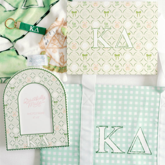 Collection of green and white patterned products with 'Kappa Delta' Greek letters on a white background