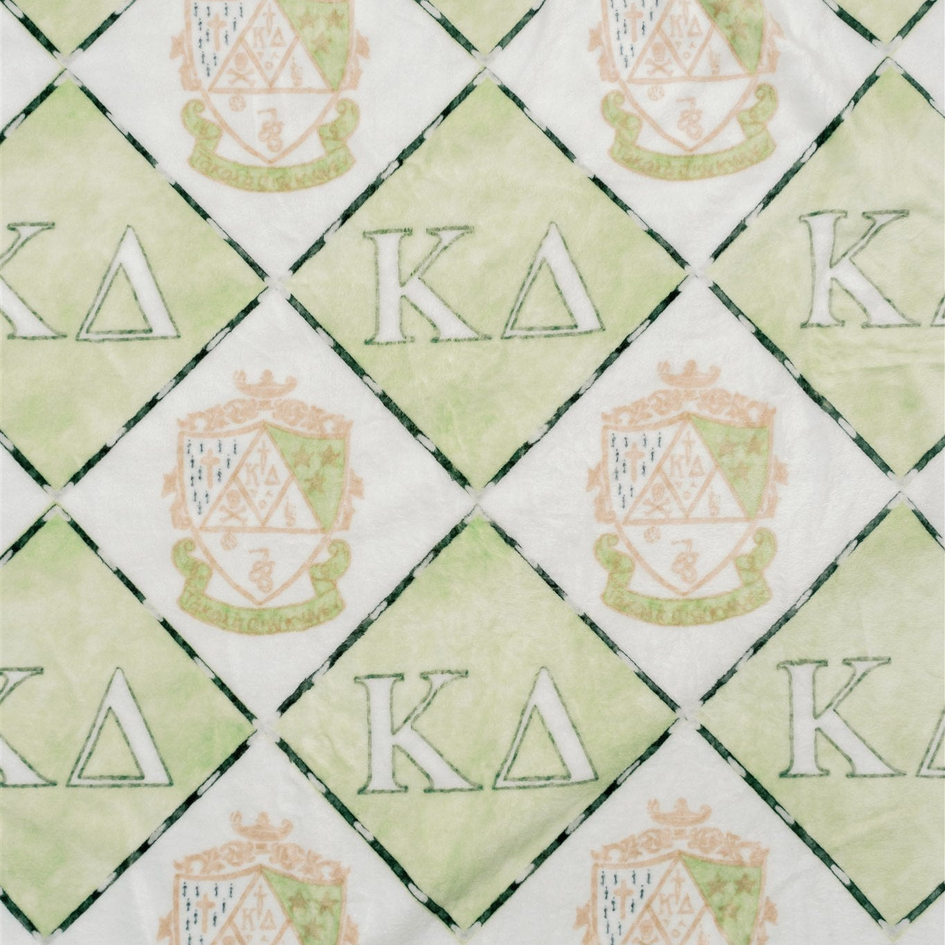 Pattern of 'Kappa Delta' symbols on a green and white background