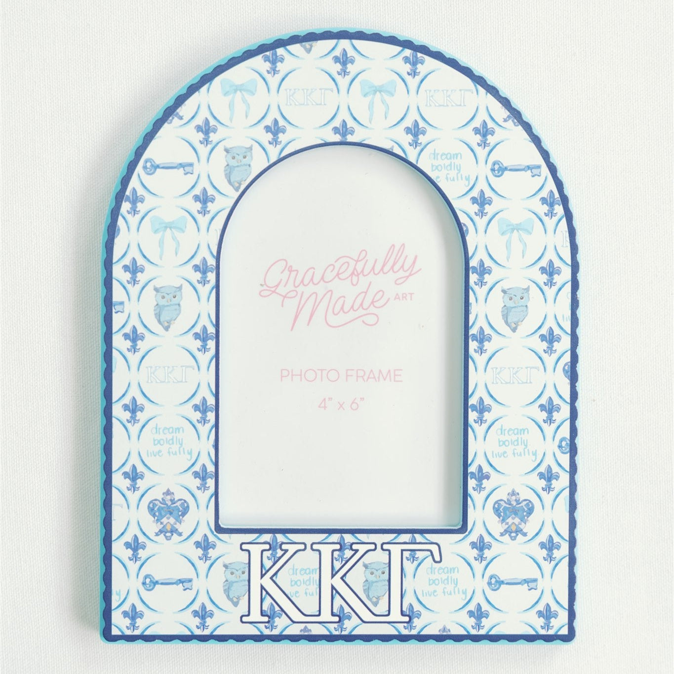 Decorative photo frame with blue and white pattern and 'Kappa Kappa Gamma' letters on a light gray background