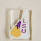 Sticker of a watercolor illustration of the LSU megaphone and a yellow and purple pom pom.