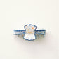 Hair clip with blue and white checkered pattern and blue scalloped edge on a white background