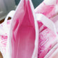 Close-up of the Phi Mu tote bag's hot pink interior liner and pockets.
