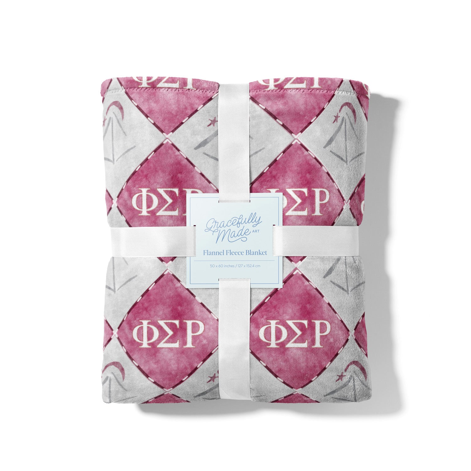 Folded pink and gray blanket with Phi Sigma Rho Greek letters on a white background