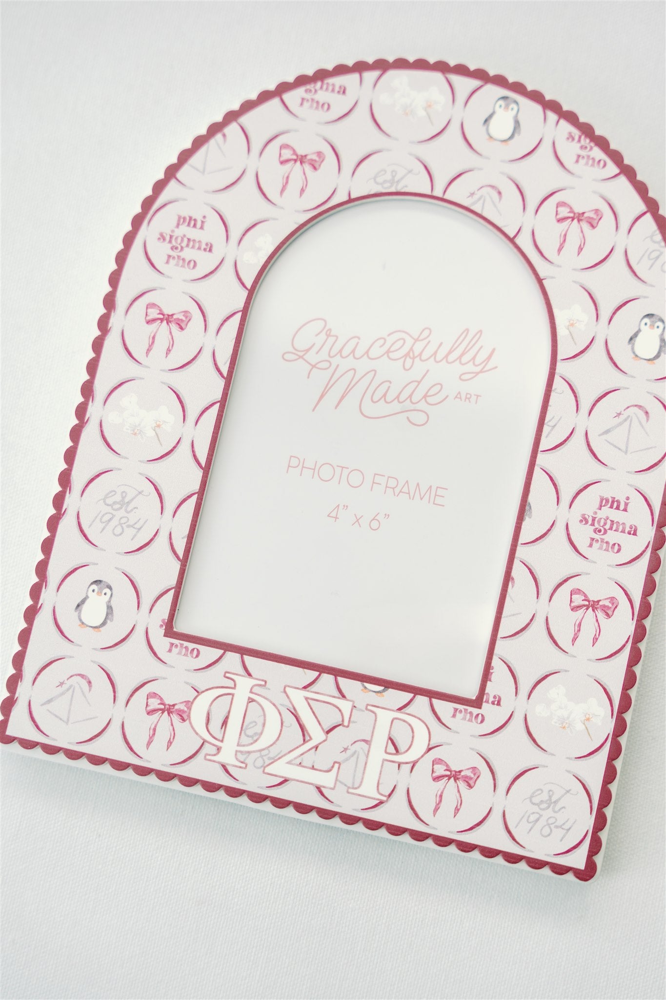 Decorative photo frame with Phi Sigma Rho Greek letters and Gracefully Made Art branding on a white background