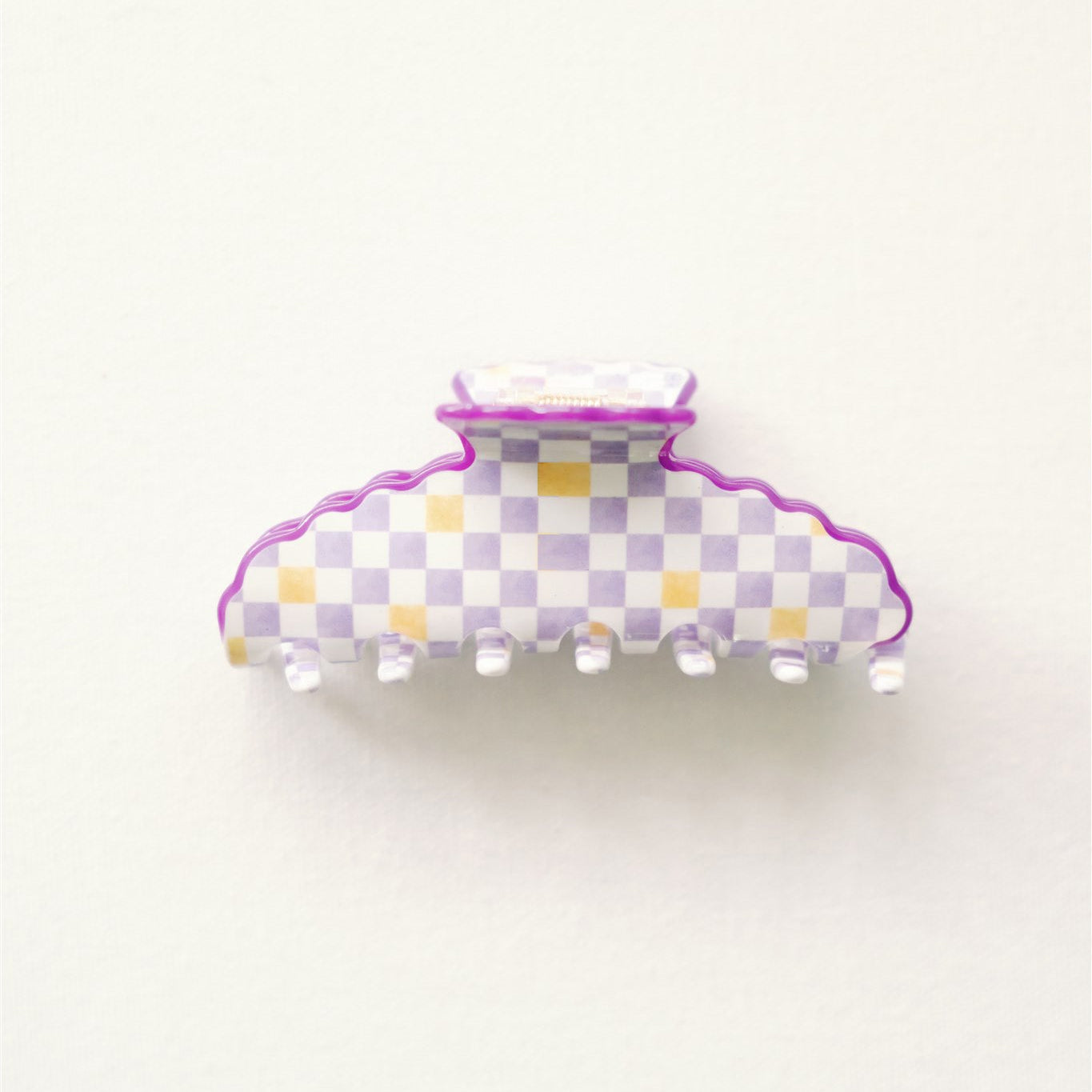 Checkered hair clip with purple border on a white background