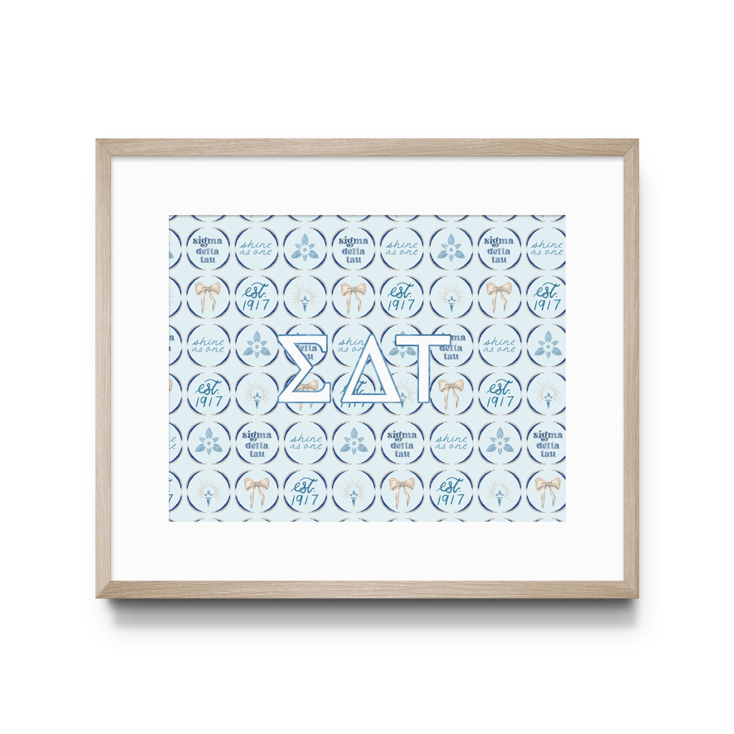 Framed artwork with decorative design and Sigma Delta Tau Greek letters on a white background