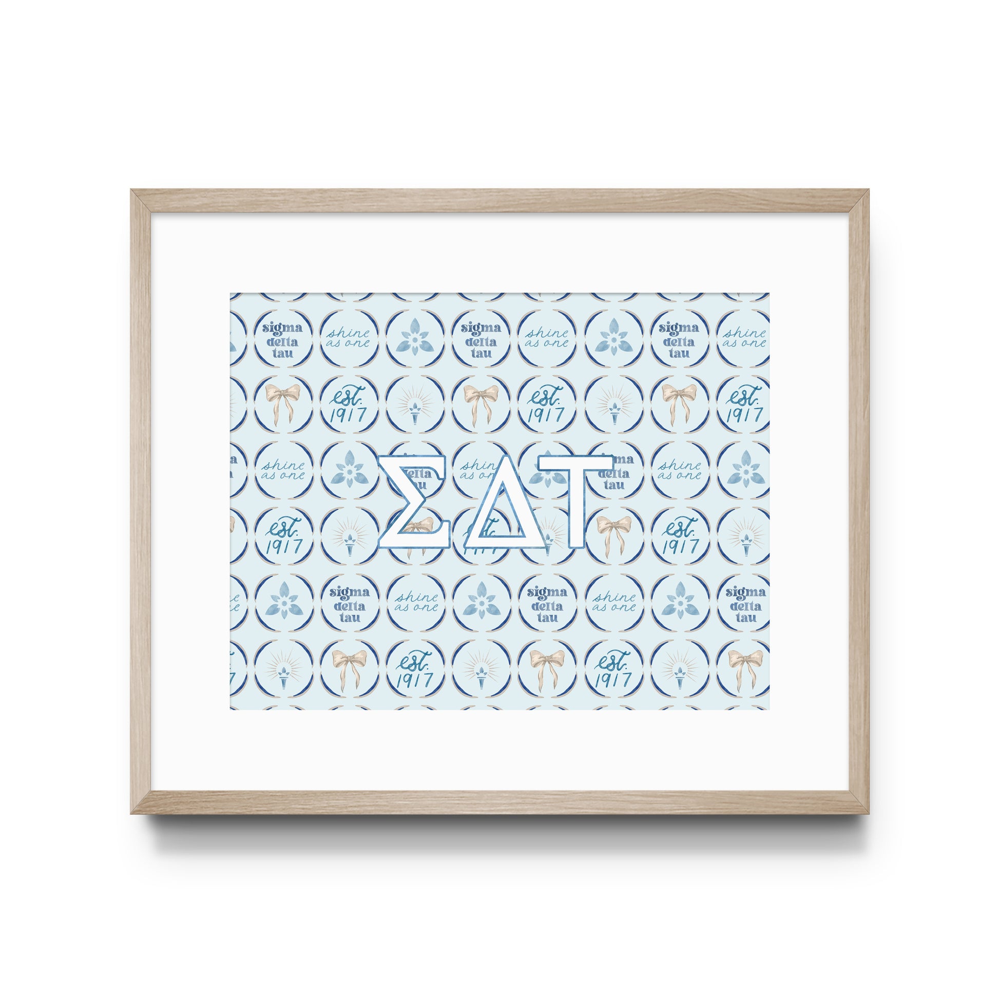 Framed artwork with decorative design and Sigma Delta Tau Greek letters on a white background