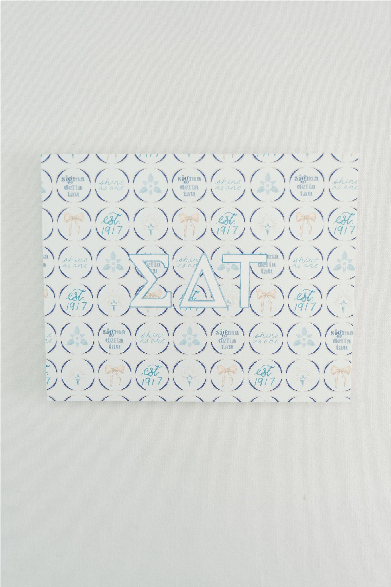 Art print with Sigma Delta Tau Greek letters and a pattern background.
