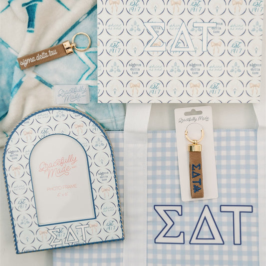 Collection of Sigma Delta Tau themed products including an art print, keychain, and photo frame