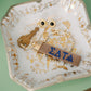 Keychain with Sigma Delta Tau Greek letters embroidered on a decorative jewelry dish.