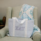 Sigma Delta Tau bag on a green armchair with a blue and white patterned blanket