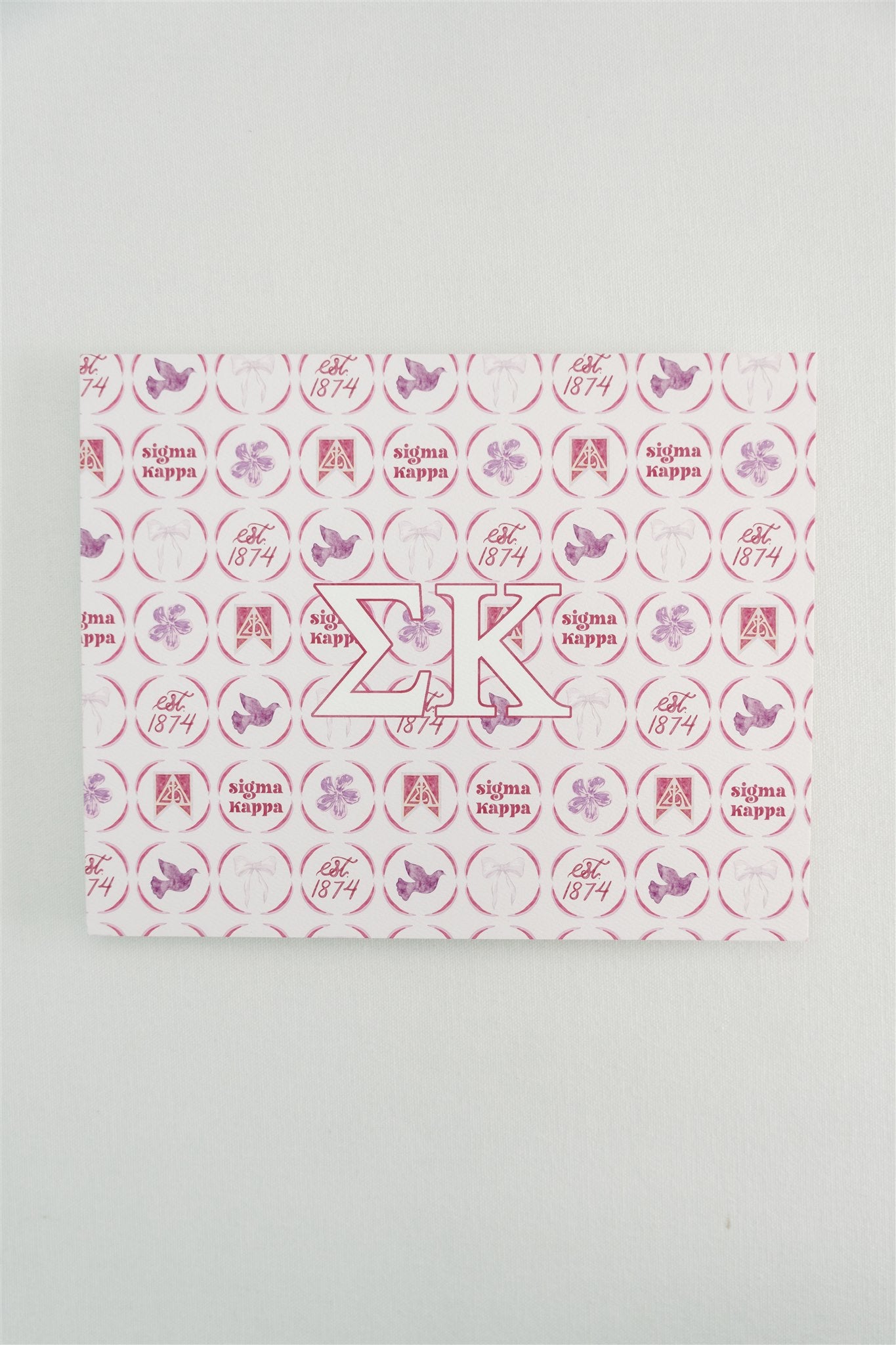 Decorative art print with circular pattern and Sigma Kappa Greek letters on a white background